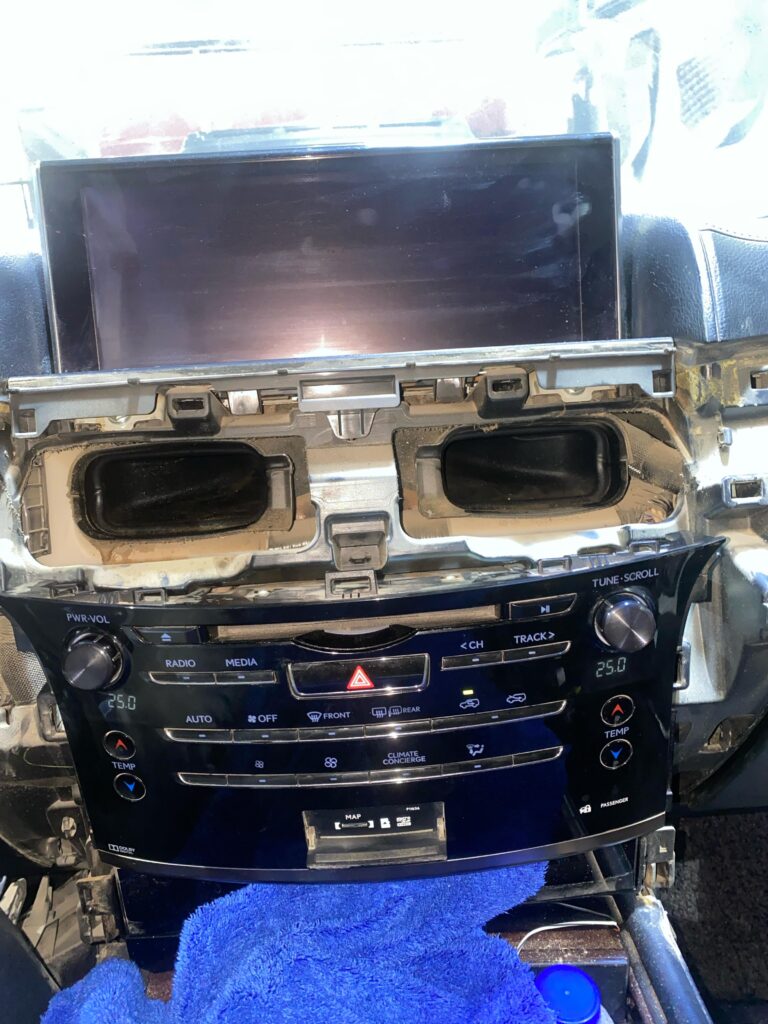 Dashboard of a 2018 Lexus LX570 showing a non-functional screen before AVN ECU replacement