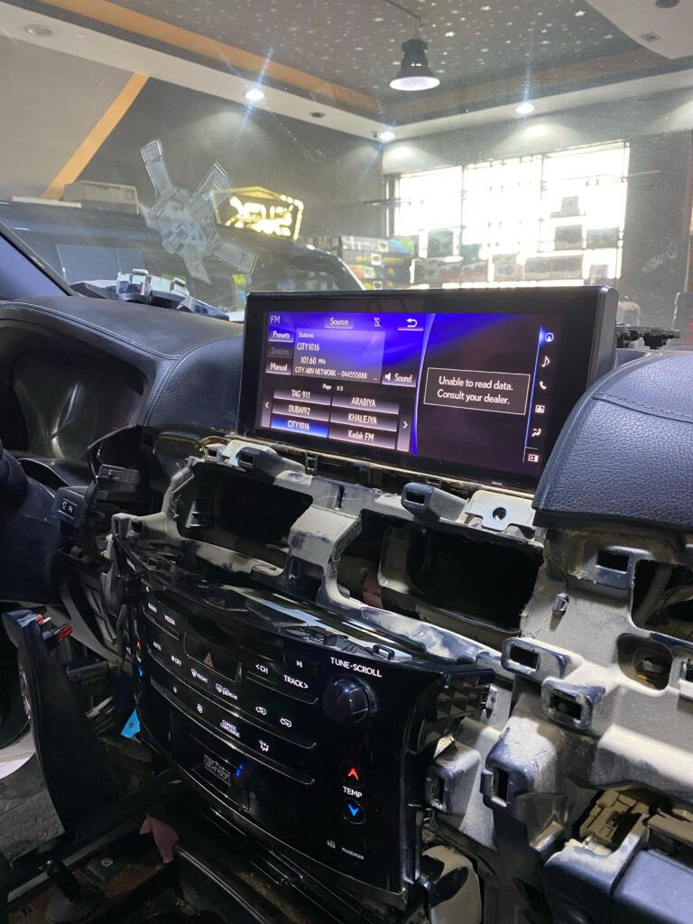 Interior of a 2018 Lexus LX570 showing the multimedia screen powered on after AVN ECU repair