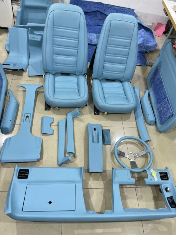 Full upholstery service completed on a classic Corvette – restored seats, door panels, and interior trim.
