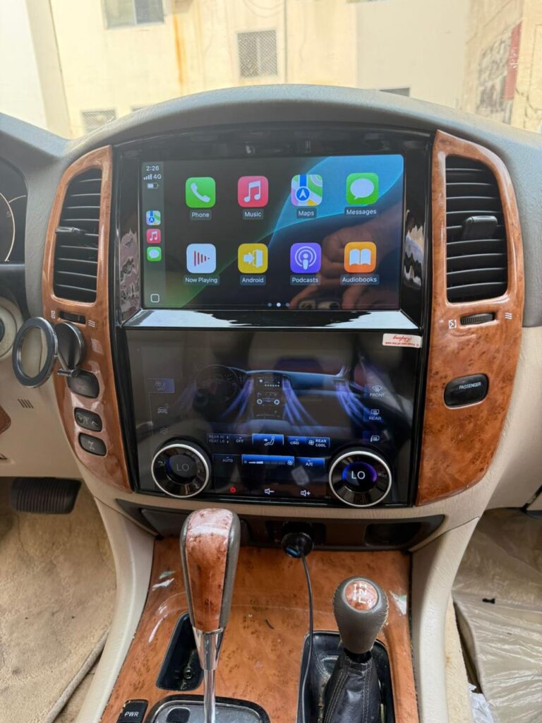 Lexus LX470 dashboard with upgraded Android screen showing CarPlay interface